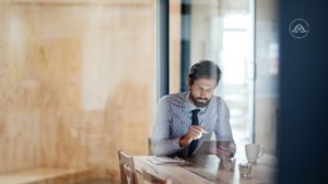 Executive experiencing burnout from constant digital connectivity and workplace pressure