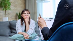 High-net-worth professional discussing confidential mental health treatment with a therapist
